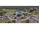 Aerial view of community clubhouse, golf course, and pool at 1891 San Silvestro Dr, Venice, FL 34285