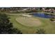 Golf course putting green with players at 1891 San Silvestro Dr, Venice, FL 34285