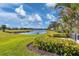 Enjoy the serene view of the pond and golf course from this backyard at 1891 San Silvestro Dr, Venice, FL 34285