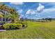 Immaculately landscaped backyard, golf course, and pond views at 1891 San Silvestro Dr, Venice, FL 34285