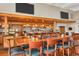 Long bar with ample seating and well-stocked shelves at 1891 San Silvestro Dr, Venice, FL 34285