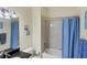 Bathroom with tub shower, granite vanity, and blue accents at 1891 San Silvestro Dr, Venice, FL 34285