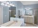 Bathroom with double vanity, large mirror and shower at 1891 San Silvestro Dr, Venice, FL 34285
