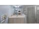 Bathroom with vanity, shower, and view into bedroom at 1891 San Silvestro Dr, Venice, FL 34285