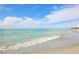 Scenic view of tranquil beach with gentle waves at 1891 San Silvestro Dr, Venice, FL 34285