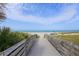 Wooden boardwalk leading to a beautiful sandy beach at 1891 San Silvestro Dr, Venice, FL 34285