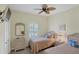 Bedroom with twin beds, ceiling fan, and wicker furniture at 1891 San Silvestro Dr, Venice, FL 34285