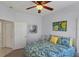 Bedroom with a queen bed, ceiling fan, and coastal decor at 1891 San Silvestro Dr, Venice, FL 34285