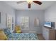 Bright bedroom with a queen bed and window shutters at 1891 San Silvestro Dr, Venice, FL 34285