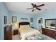 Bedroom with ensuite bathroom and large window at 1891 San Silvestro Dr, Venice, FL 34285