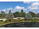 Pelican Pointe community entrance with pond at 1891 San Silvestro Dr, Venice, FL 34285