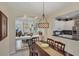 Bright dining room with a view into the kitchen and living room at 1891 San Silvestro Dr, Venice, FL 34285