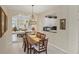 Bright dining room featuring a spacious table and modern light fixture at 1891 San Silvestro Dr, Venice, FL 34285