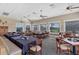 Bright dining room with multiple tables and seating, ideal for events at 1891 San Silvestro Dr, Venice, FL 34285