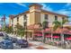 Three-story building with street-level businesses and outdoor seating at 1891 San Silvestro Dr, Venice, FL 34285