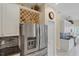 Modern kitchen features white cabinets, granite counters, and a wine rack at 1891 San Silvestro Dr, Venice, FL 34285