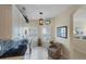 Bright kitchen nook boasts granite counters, white cabinets, and a built-in desk at 1891 San Silvestro Dr, Venice, FL 34285