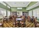 Community library with tables, chairs, and bookshelves at 1891 San Silvestro Dr, Venice, FL 34285