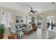 Bright living room with comfy seating and access to patio at 1891 San Silvestro Dr, Venice, FL 34285