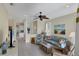 Bright living room with comfortable seating, and a view of the kitchen and dining area at 1891 San Silvestro Dr, Venice, FL 34285
