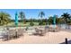 Outdoor patio area with tables, chairs, and golf course view at 1891 San Silvestro Dr, Venice, FL 34285