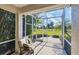 Spacious screened patio with seating and stunning golf course views at 1891 San Silvestro Dr, Venice, FL 34285