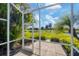 Screened patio with access to a beautiful golf course and pond at 1891 San Silvestro Dr, Venice, FL 34285