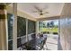 Relaxing screened patio with seating area overlooking a lush golf course at 1891 San Silvestro Dr, Venice, FL 34285