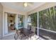 Bright and airy screened patio with table and seating area at 1891 San Silvestro Dr, Venice, FL 34285