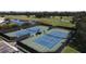 Two well-maintained tennis courts with surrounding fencing at 1891 San Silvestro Dr, Venice, FL 34285