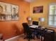 Home office with a desk, computer, and artwork at 19010 Mangieri St, Venice, FL 34293