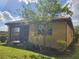 Single-story house with a screened patio and landscaped yard at 19010 Mangieri St, Venice, FL 34293