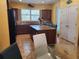 Spacious kitchen with granite island and wood cabinets at 19010 Mangieri St, Venice, FL 34293