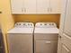 Laundry room with Whirlpool washer and dryer at 19010 Mangieri St, Venice, FL 34293