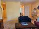 Living room with two blue armchairs and red couch at 19010 Mangieri St, Venice, FL 34293