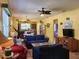 Open living room with comfortable seating, hardwood floors, and a view into the kitchen at 19010 Mangieri St, Venice, FL 34293