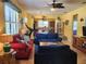 Open living room with comfortable seating, hardwood floors, and a view into the kitchen at 19010 Mangieri St, Venice, FL 34293