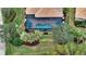 Bird's eye view of home, pool, and lush landscaping at 19500 Petrino St, Venice, FL 34293