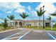 Community clubhouse with palm trees and ample parking at 19500 Petrino St, Venice, FL 34293