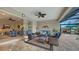 Covered patio with wicker furniture, and view of living room at 19500 Petrino St, Venice, FL 34293