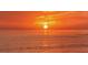 Orange sunset over calm ocean water at 19500 Petrino St, Venice, FL 34293