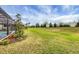 Landscaped backyard with lush lawn and privacy at 19807 Bridgetown Loop, Venice, FL 34293