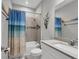 Clean bathroom with shower/tub combo and updated vanity at 19807 Bridgetown Loop, Venice, FL 34293
