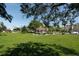 Landscaped community park featuring a gazebo and lush green space at 19807 Bridgetown Loop, Venice, FL 34293