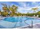 Refreshing community pool with ample lounge chairs and surrounding landscaping at 19807 Bridgetown Loop, Venice, FL 34293