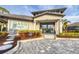 Community clubhouse entrance with a pool and landscaping at 19807 Bridgetown Loop, Venice, FL 34293