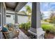 Relaxing front porch with wicker chairs and view of neighborhood at 19807 Bridgetown Loop, Venice, FL 34293