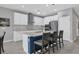 Modern kitchen featuring stainless steel appliances and a center island at 19807 Bridgetown Loop, Venice, FL 34293