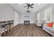 Open living space with hardwood floors and comfortable seating at 19807 Bridgetown Loop, Venice, FL 34293