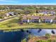 Aerial view of condo building and beautiful canal at 200 Silver Lake Dr # 105, Venice, FL 34292